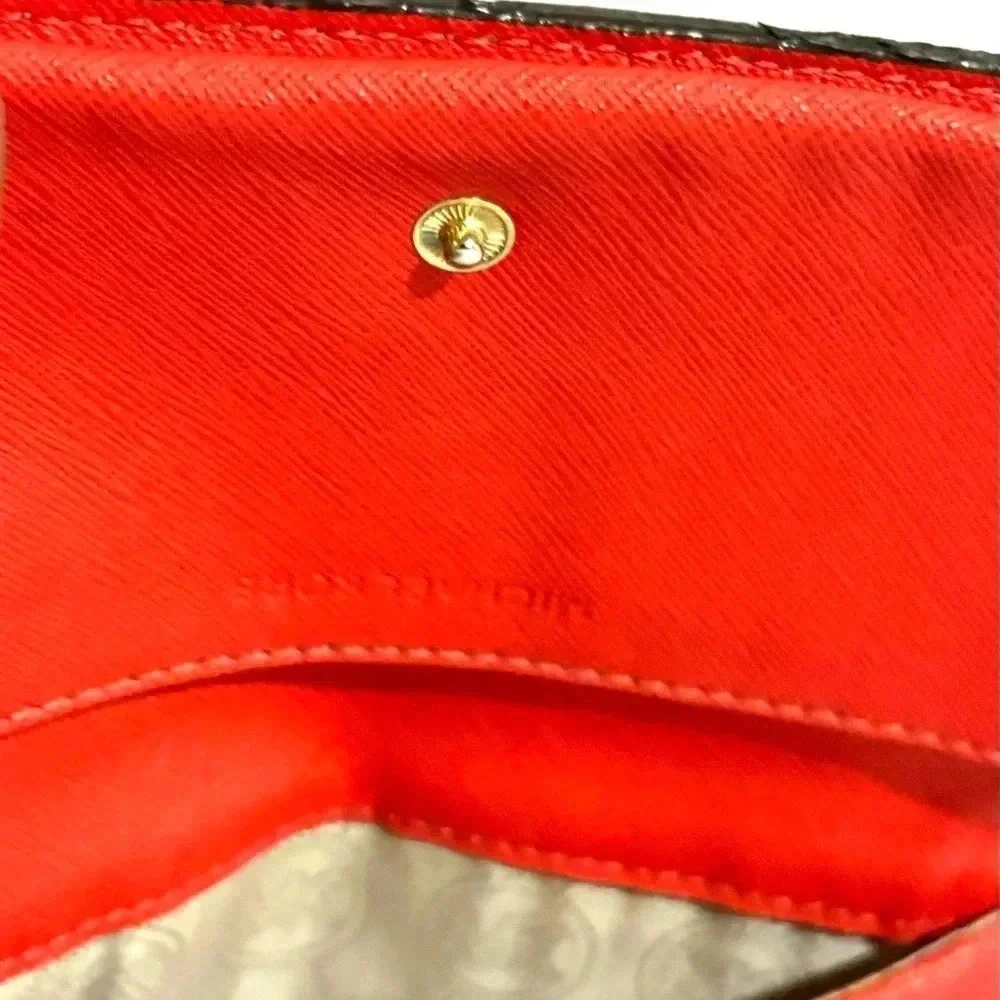 Michael Kors orange leather leather wristlet wallet